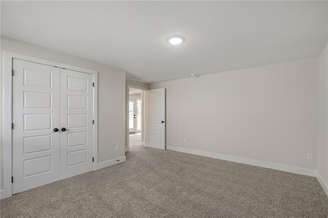 19389 W 114th Ter, Olathe, KS 66061 - unfurnished bedroom with carpet, a closet, and a textured ceiling