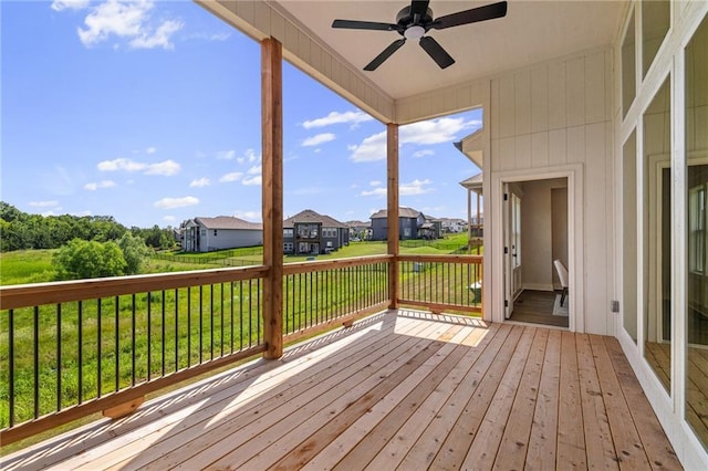 19389 W 114th Ter, Olathe, KS 66061 - deck featuring a ceiling fan, a residential view, and a yard