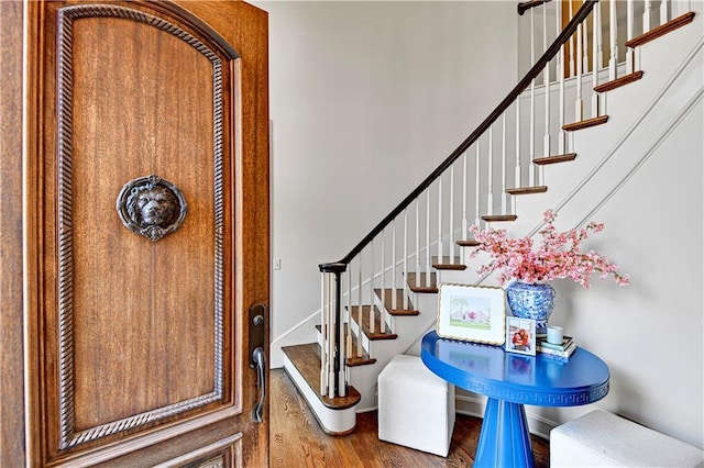 4319 N Mulberry Dr, Kansas City, MO 64116 - entrance foyer featuring stairs and wood finished floors