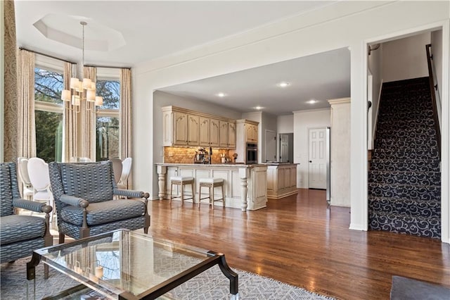 4319 N Mulberry Dr, Kansas City, MO 64116 - living room featuring baseboards, stairway, recessed lighting, and dark wood-type flooring