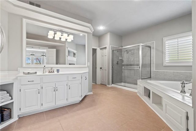 4319 N Mulberry Dr, Kansas City, MO 64116 - bathroom featuring a shower stall, a wealth of natural light, visible vents, and a bath