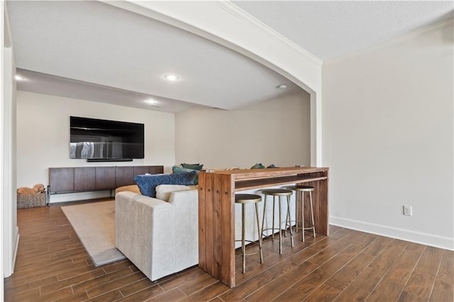 4319 N Mulberry Dr, Kansas City, MO 64116 - living room with wood finished floors, baseboards, arched walkways, ornamental molding, and recessed lighting