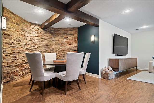 4319 N Mulberry Dr, Kansas City, MO 64116 - dining room with beam ceiling, a textured ceiling, baseboards, and wood finished floors