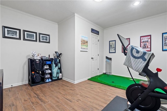 4319 N Mulberry Dr, Kansas City, MO 64116 - exercise area featuring wood finished floors, baseboards, and ornamental molding