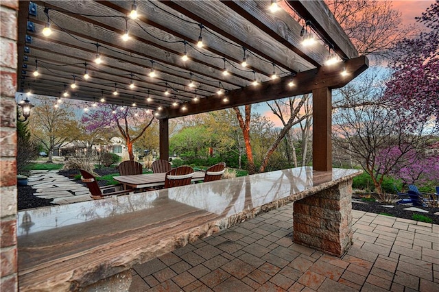 4319 N Mulberry Dr, Kansas City, MO 64116 - view of patio featuring outdoor dining area, a pergola, and outdoor dry bar