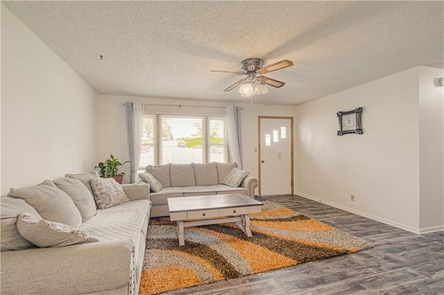 435 NE 41st Ter, Kansas City, MO 64116 - living area with baseboards, a ceiling fan, wood finished floors, and a textured ceiling