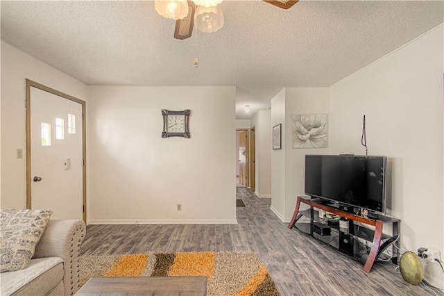 435 NE 41st Ter, Kansas City, MO 64116 - living room with baseboards, a ceiling fan, wood finished floors, and a textured ceiling
