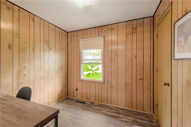 435 NE 41st Ter, Kansas City, MO 64116 - office space featuring wood finished floors, wood walls, and visible vents
