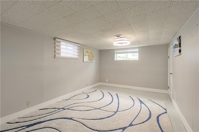 435 NE 41st Ter, Kansas City, MO 64116 - below grade area with baseboards and light carpet