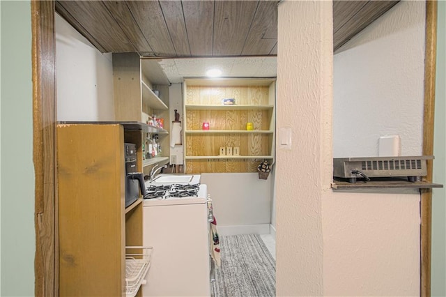435 NE 41st Ter, Kansas City, MO 64116 - washroom with a sink, washer / dryer, and a textured wall