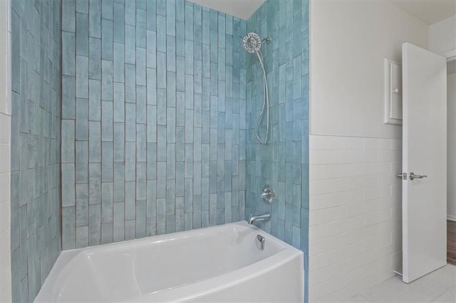 full bathroom with tile patterned floors and  shower combination