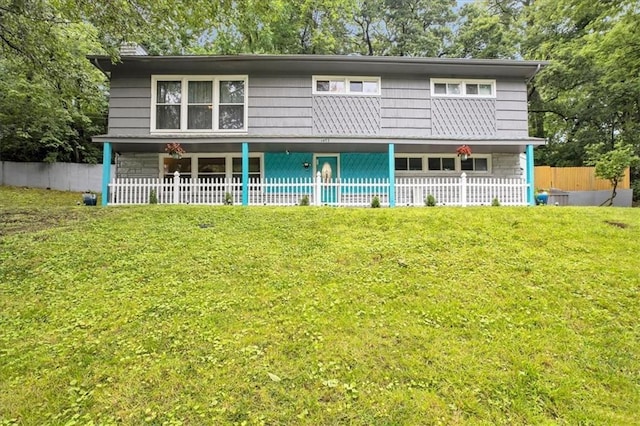 1477 Spruce Ave, Liberty, MO 64068 - view of front facade featuring a front lawn and fence