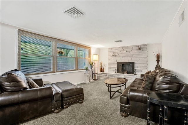 1477 Spruce Ave, Liberty, MO 64068 - living area with a fireplace, visible vents, and carpet floors