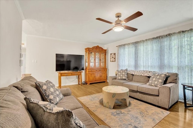 1477 Spruce Ave, Liberty, MO 64068 - living room with light wood-type flooring, ornamental molding, and ceiling fan