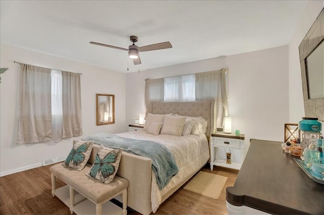 1477 Spruce Ave, Liberty, MO 64068 - bedroom with visible vents, ceiling fan, wood finished floors, and baseboards