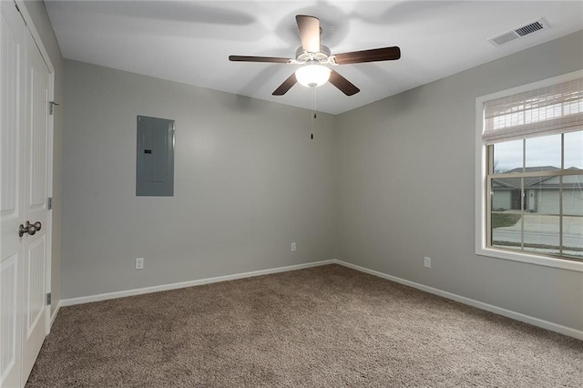 103 N Sivley St, Peculiar, MO 64078 - carpeted spare room with electric panel, baseboards, visible vents, and a ceiling fan