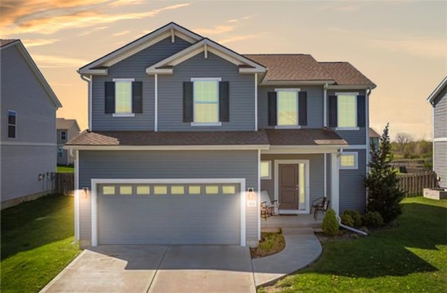 1423 SW Fairfax Rd, Lees Summit, MO 64083 - view of front facade featuring a front yard, driveway, and a garage
