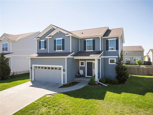 1423 SW Fairfax Rd, Lees Summit, MO 64083 - view of front of house with driveway, a garage, and a shingled roof