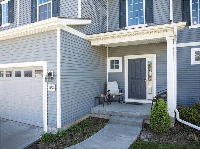 1423 SW Fairfax Rd, Lees Summit, MO 64083 - view of exterior entry featuring a garage and a porch