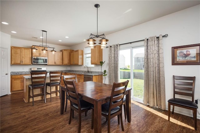 1423 SW Fairfax Rd, Lees Summit, MO 64083 - dining space with dark wood-type flooring, recessed lighting, healthy amount of natural light, and a chandelier