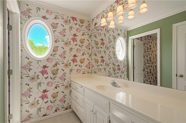 bathroom with wallpapered walls, vanity, ornamental molding, and baseboards