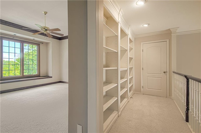 corridor featuring crown molding, carpet, baseboards, and recessed lighting