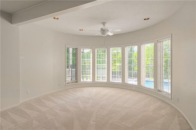 empty room with light colored carpet, ceiling fan, baseboards, and recessed lighting