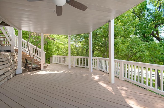 wooden deck with stairway and a ceiling fan
