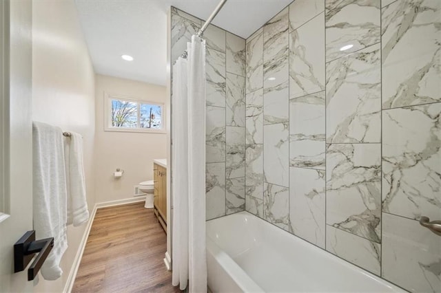 full bathroom with vanity, recessed lighting, wood finished floors, shower / tub combo with curtain, and baseboards