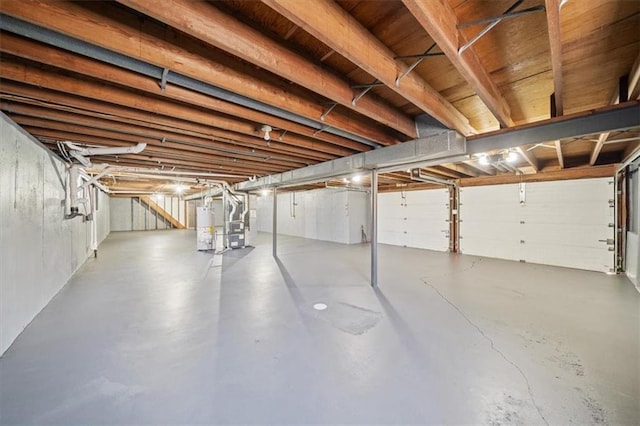 basement with heating unit and water heater