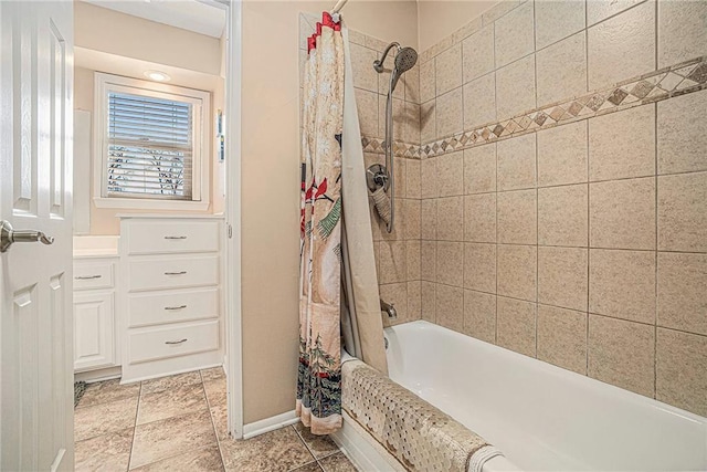 bathroom featuring shower / bath combo with shower curtain and baseboards