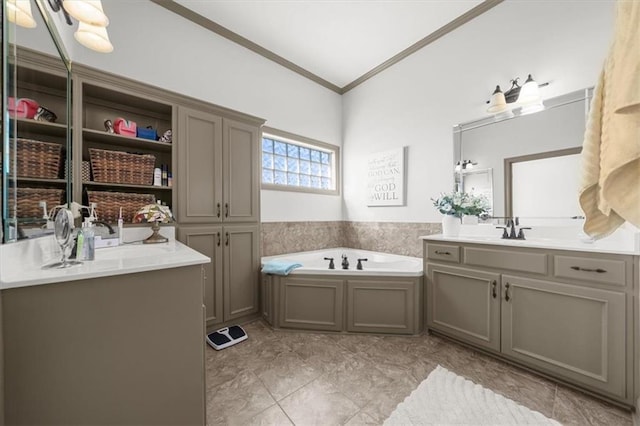 bathroom featuring two vanities, a garden tub, a sink, and crown molding