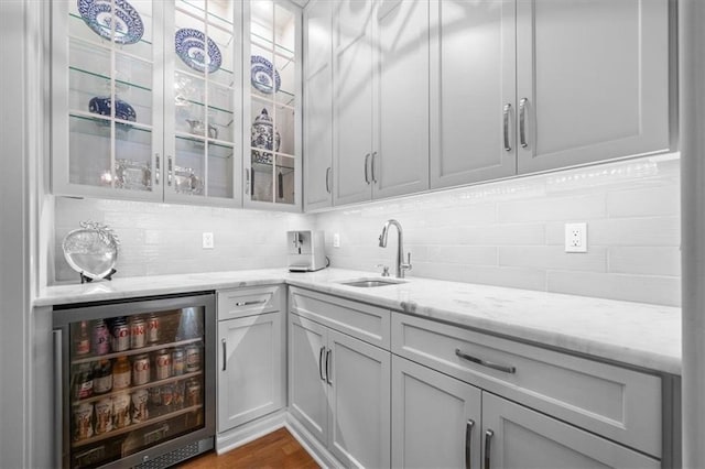 2189 W 89th Pl, Leawood, KS 66206 - bar featuring dark wood-type flooring, backsplash, a sink, and beverage cooler