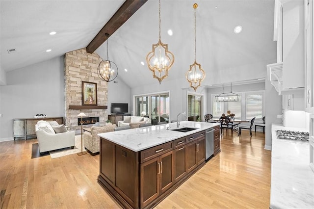 2189 W 89th Pl, Leawood, KS 66206 - kitchen featuring an inviting chandelier, beam ceiling, light wood finished floors, dishwasher, and a sink