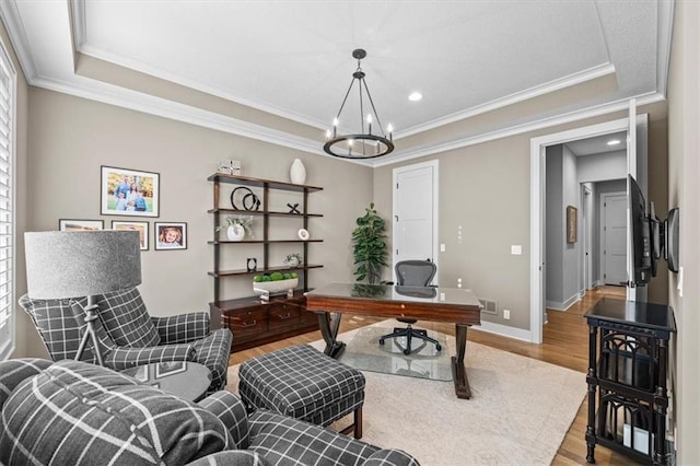 2189 W 89th Pl, Leawood, KS 66206 - office area with a tray ceiling, crown molding, wood finished floors, and an inviting chandelier