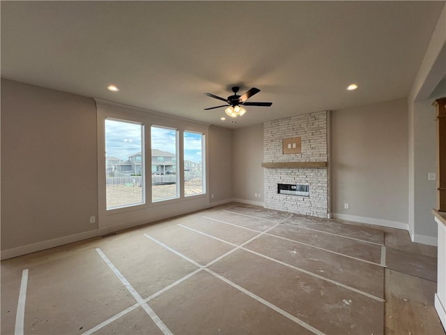 16941 S Brentwood St, Olathe, KS 66062 - unfurnished living room with a ceiling fan, baseboards, a fireplace, and recessed lighting