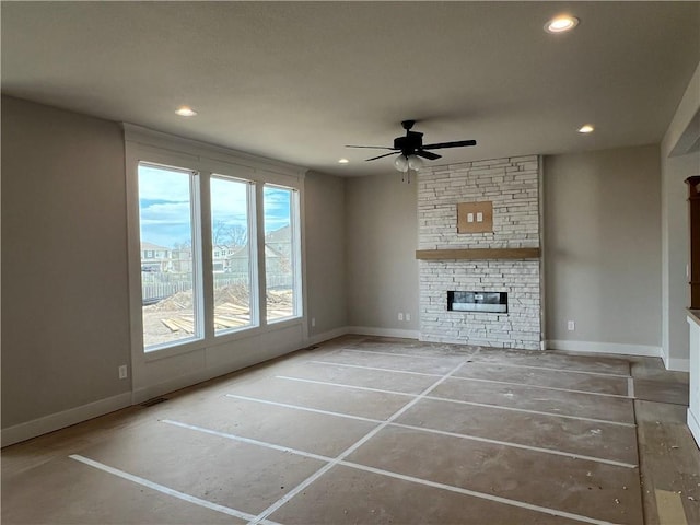 16941 S Brentwood St, Olathe, KS 66062 - unfurnished living room with baseboards, a fireplace, ceiling fan, and recessed lighting