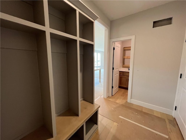 16941 S Brentwood St, Olathe, KS 66062 - mudroom with baseboards and light wood-style floors