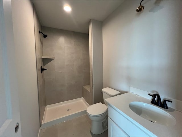 16941 S Brentwood St, Olathe, KS 66062 - full bathroom with tile patterned floors, toilet, tiled shower, and vanity