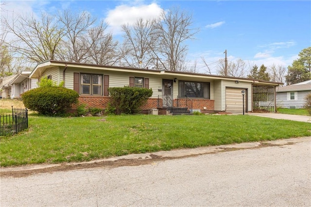 601 Westside Dr, Knob Noster, MO 65336 - view of front of property featuring brick siding, an attached garage, and concrete driveway
