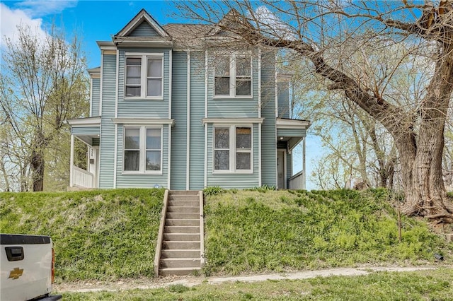 view of front of house with stairs