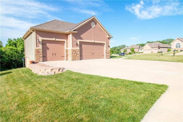 view of front of property featuring stone siding, an attached garage, a front lawn, and concrete driveway