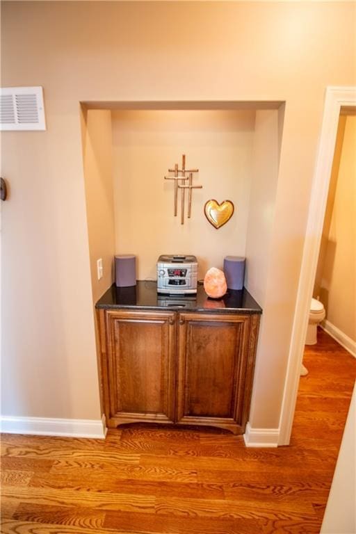 detailed view of wood finished floors and baseboards