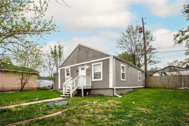 2915 Farrow Ave, Kansas City, KS 66104 - view of front facade with a front yard and fence