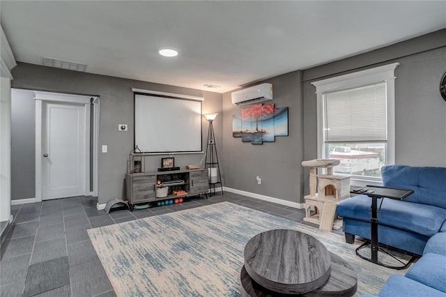 2915 Farrow Ave, Kansas City, KS 66104 - cinema room with visible vents, baseboards, dark tile patterned flooring, and an AC wall unit