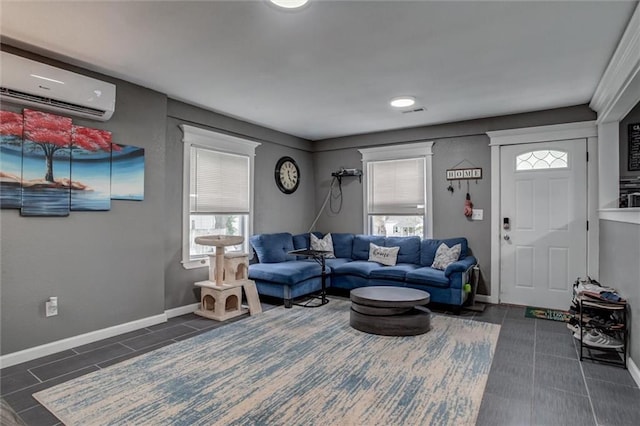 2915 Farrow Ave, Kansas City, KS 66104 - living area featuring baseboards, dark tile patterned floors, a wall unit AC, and a healthy amount of sunlight