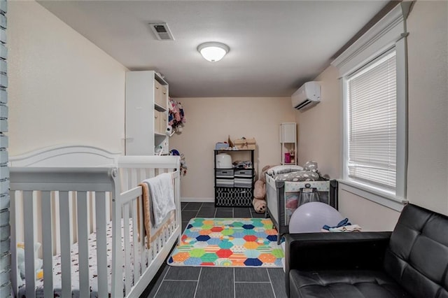 2915 Farrow Ave, Kansas City, KS 66104 - bedroom featuring a wall mounted AC, baseboards, visible vents, and dark tile patterned flooring