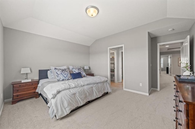 9874 Belmont Dr, Lenexa, KS 66227 - bedroom featuring light carpet, baseboards, and lofted ceiling