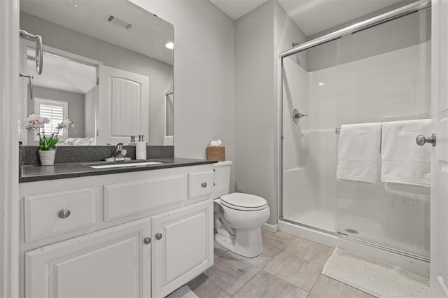 9874 Belmont Dr, Lenexa, KS 66227 - bathroom featuring a shower stall, toilet, and vanity