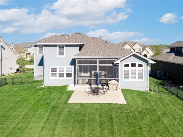 9874 Belmont Dr, Lenexa, KS 66227 - back of house featuring a patio area, a sunroom, central AC unit, and roof with shingles